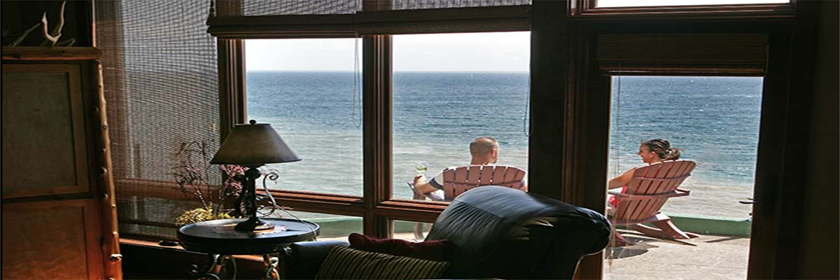 Two resort guests lounging outside their room